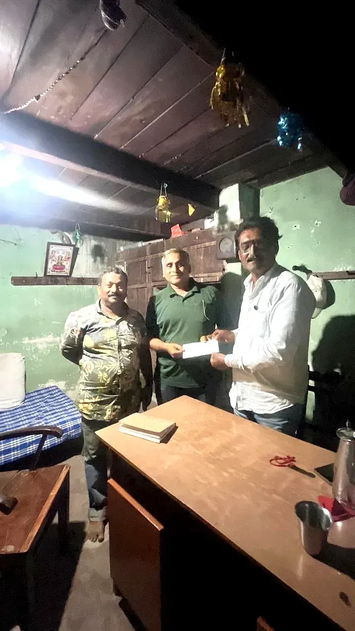 Cash being counted out to a farmer across a desk