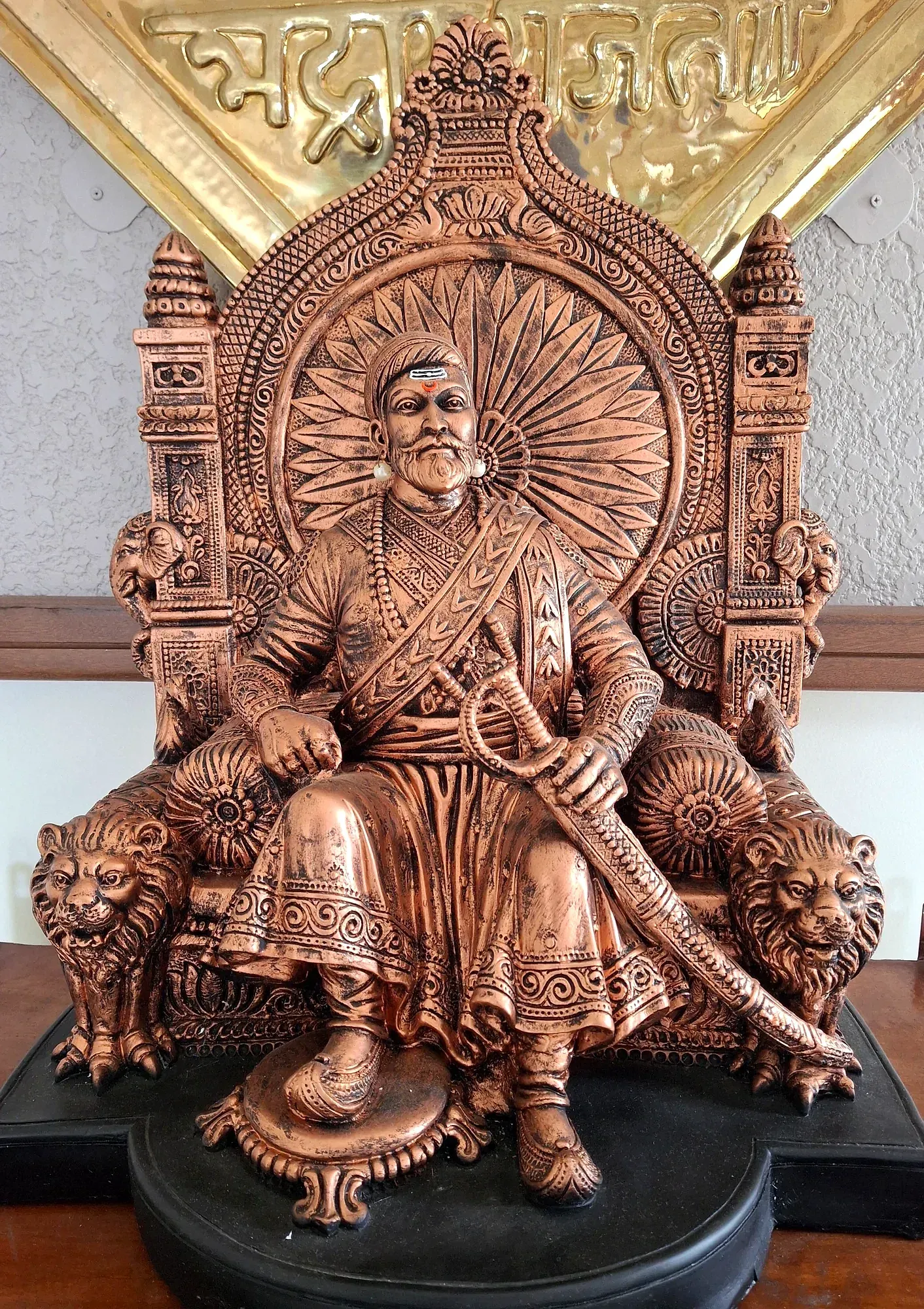 A bronze-finish seated statue of Chhatrapati Shivaji Maharaj